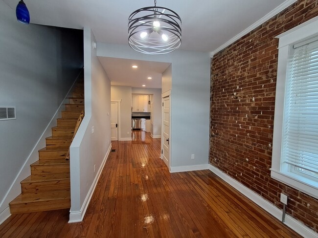 View from front room through dining to kitchen - 1007 E McCarty St Unit B