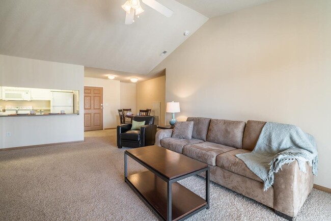 Spacious living rooms offer the perfect setting to relax or entertain, with plenty of room for your favorite furniture. - Pinebrook Apartments