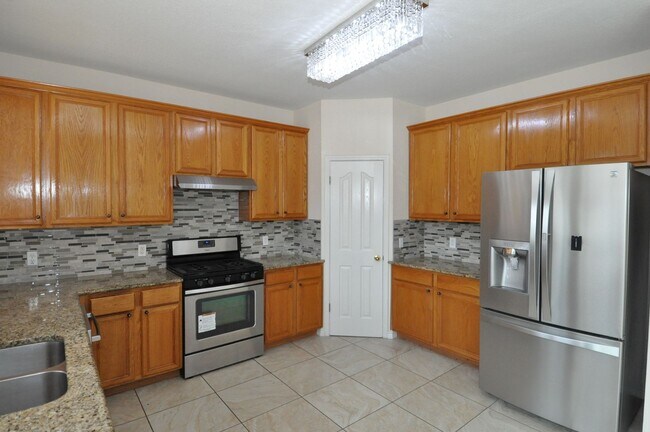 Photo - Spacious home for growing family with multiple dining and living areas! HUGE backyard!