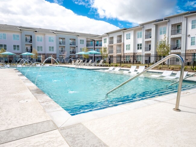 Resort-Style Pool with Baja Tanning Shelf - The Waters At Millerville