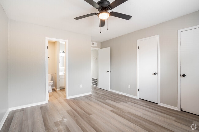 2BR, 1BA - 851SF - Primary Bedroom - Springs of Lake Jackson Apartments