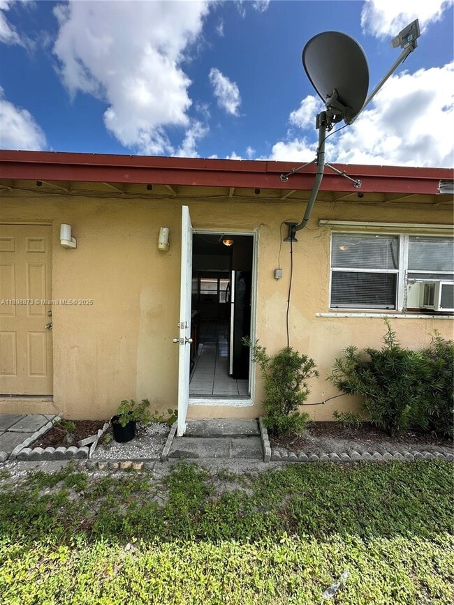 Building Photo - 5797 Flagler St Unit 2