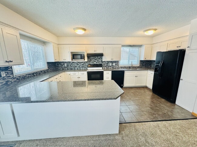 Photo - Single Family Home with 4-Bedrooms and 2 bathrooms in Coon Rapids