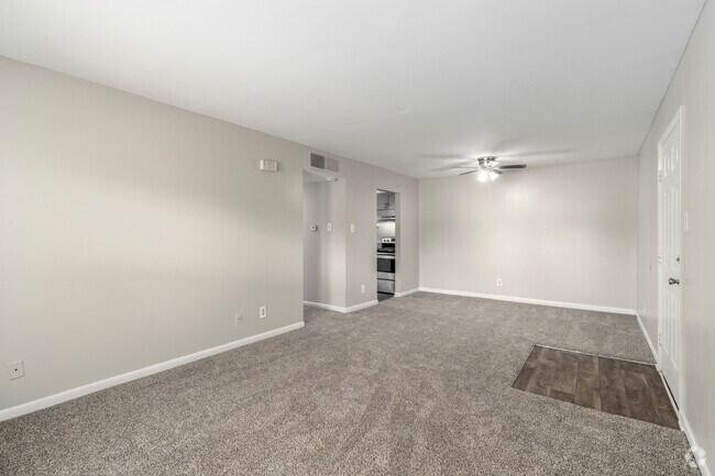 3BR, 1BA - 1,012SF - Living Room & Dining Room