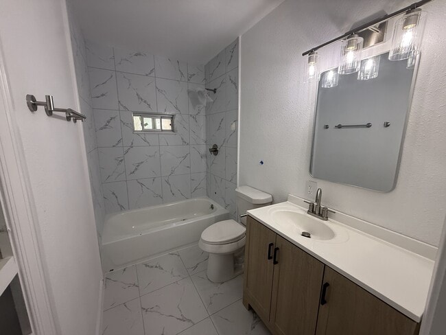 One of two bathrooms, this one with tub/shower combo - 3807 Otis St