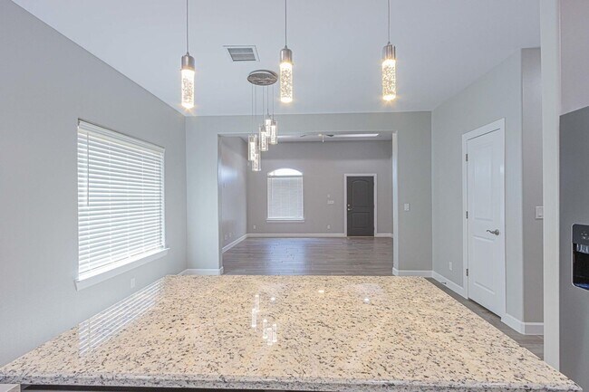 Photo - Modern open floor plan, perfect for comfortable living and entertaining.