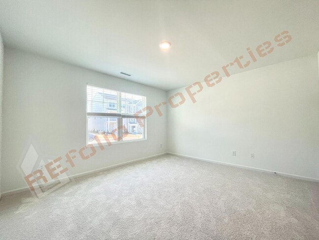 Photo - Brand New 3 Story, 4 bedroom, 3.5 bathroom Townhome Featuring a 1st floor Guest Suite, 2 Car Gara...