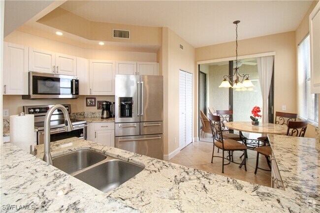 Building Photo - 7024 Pelican Bay Blvd Unit F-504 Rental