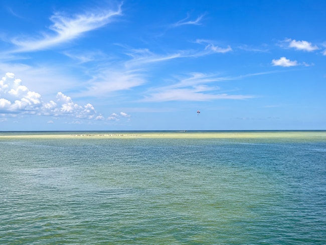 Building Photo - Meticulous Gulf front condo with unobstructed views of the clear blue water.