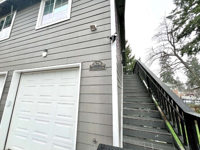 Photo - Elevated 3-Bedroom Home with Secure Garage & Cozy Living Space Unit C