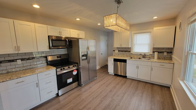 Photo - 3 Bedroom With A Finished Basement And Large Back Yard