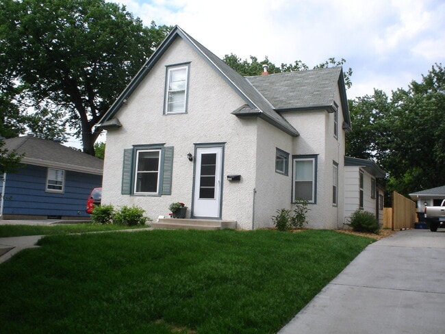 Building Photo - Charming 4-Bedroom Minneapolis Home with Finished Basement & Hardwood Floors