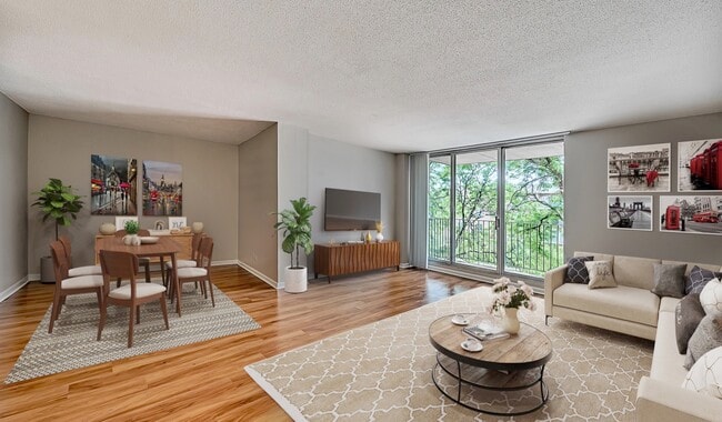 Large open living room opening up to a spacious balcony. - 2200 Grace