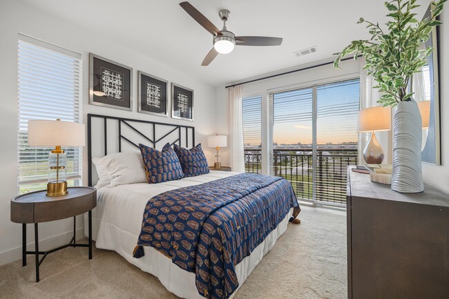 Spacious bedroom with floor to ceiling windows to maximize light