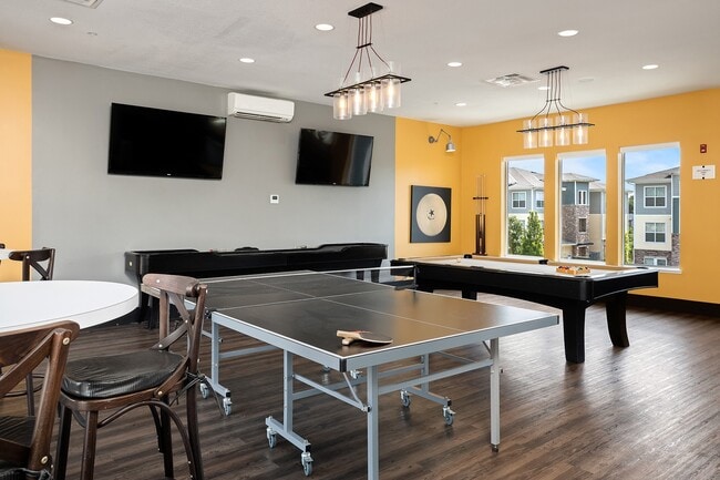 Game room with billiards and ping pong tables