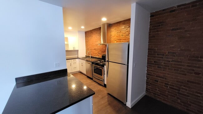 Great exposed brick throughout! - 403 N Charles St Unit Suite 500