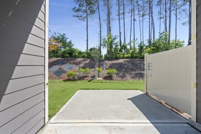 Photo - Elegant 3-Bed Townhome , Screened Porch & 2-Car Garage – Prime Davis Drive Location