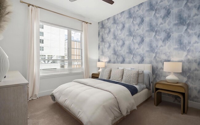 Spacious Bedroom with King Bed, Dark Accent Wall, and Elegant Lighting