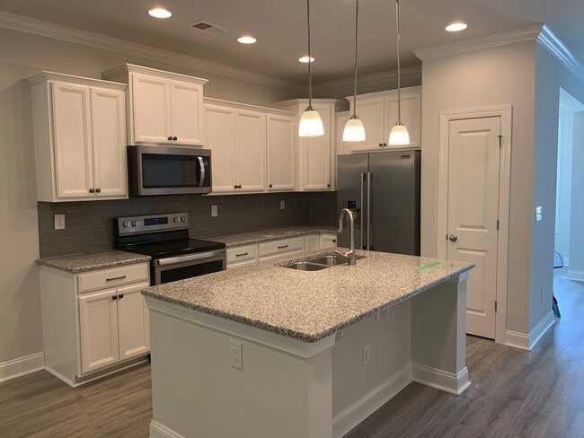 Photo - 4 Bedroom, 2.5 Bath, Pet Friendly Town Home with Garage Within Barefoot Resort and Golf! Availabl...