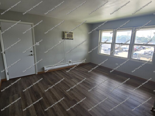 Building Photo - One Bedroom Second Floor Condo