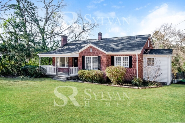 Building Photo - The living is easy in this 3 bedroom, 2 bathroom brick home