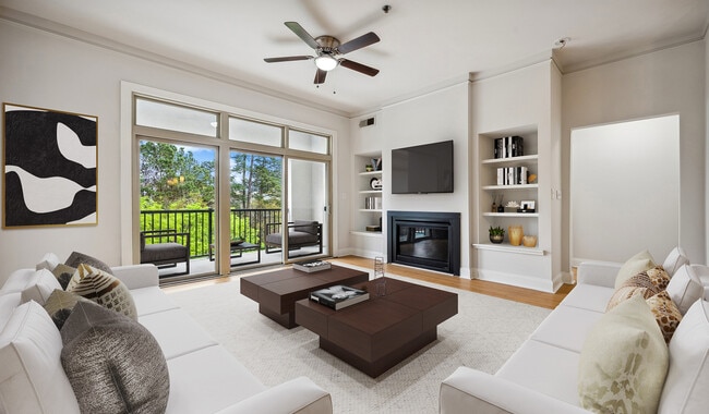 Living room with wood flooring and patio access