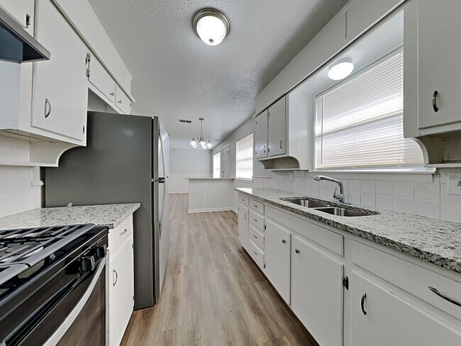 Photo - Newly Renovated Single Family Home | 3 BR/1.5BA | 1-Car Covered Parking | Gated backyard