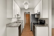 Experience the elegance of this modern kitchen, featuring stylish cabinetry and state-of-the-art appliances.
