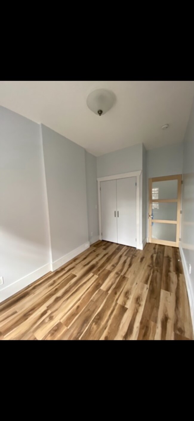 Bedroom #1. Lighted closet with custom shelves. - 1202 Rogers Ave Unit 1202 Rogers Ave. Apt #3b