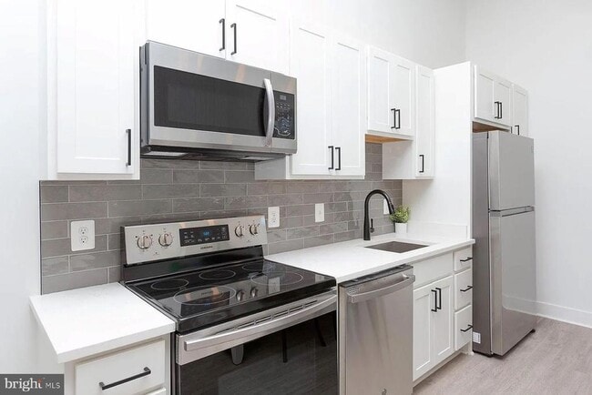 Building Photo - 211 St Paul St Unit 405