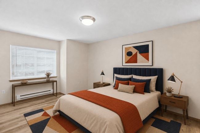 A versatile second bedroom ready for guests, roommates, or a personalized retreat. - Tudor Village at the Mall Apartments