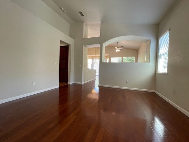 Photo - Fireplace in Living Room, Backyard Patio, Hardwood and Laminate Flooring