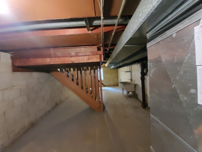 Very large Basement The stairway is located in the middle of the basement