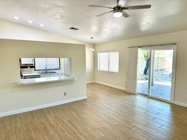 Photo - Beautifully updated Mesa home near Whitman Park with wood-look tile, fresh paint, vaulted ceiling...
