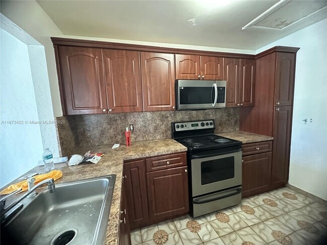 Building Photo - 6675 W 26th Ct Unit 23-9