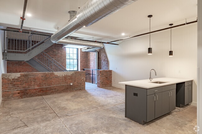 1BR, 1.5BA - 1,239SF - Kitchen and Living Area