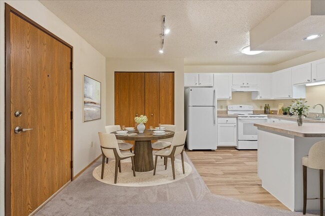 Open-Concept Kitchen and Dining - Maple Creek Apartments