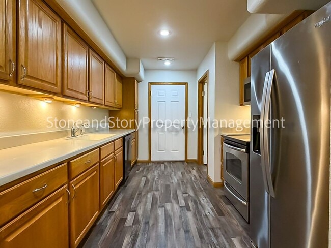 Photo - 2 bedroom 1.5 bath duplex with sunroom, 2 car garage and fenced yard