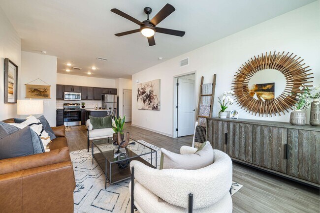 Open concept apartment floorplans with ceiling fans in living rooms at The Groves at Lake Juliana - The Groves at Lake Juliana