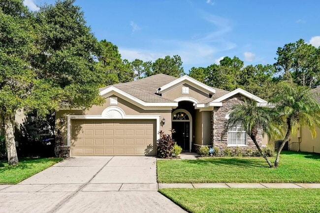 Building Photo - "Stunning 3BR Orlando Home with Private Screened Pool, Spa & Spacious Living Areas"