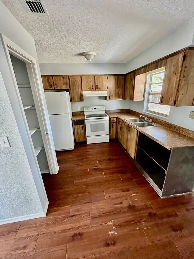 Photo - SPACIOUS 3BR/1.5BA w/Carport, Beautiful Wood Finish Flooring, Privacy Fenced Backyard! NO APP FEE!