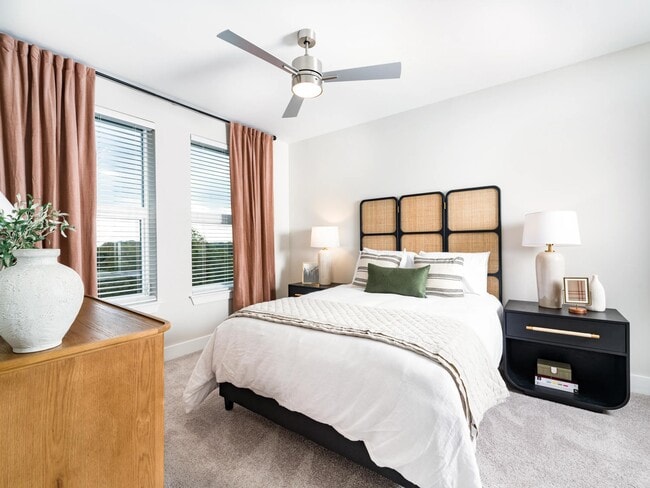 A bright primary bedroom with generous natural light, soft finishes, and a calm layout designed for everyday comfort and ease.