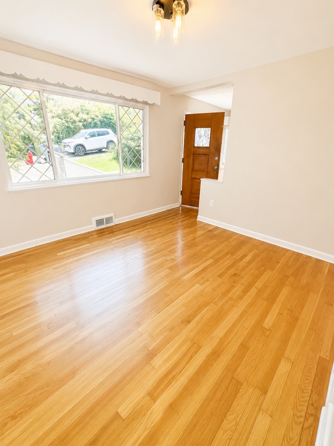 Photo - Charming 3-Bedroom Home with Hardwood Floors, Garage & Private Patio