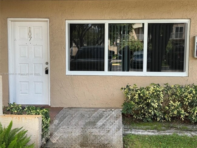 Building Photo - 8670 NW 6th Ln Unit 4-107 Rental