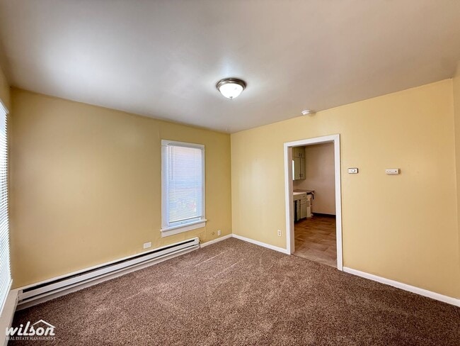 Photo - Cozy 2-Bedroom Home with Fenced Yard & Rear Parking!