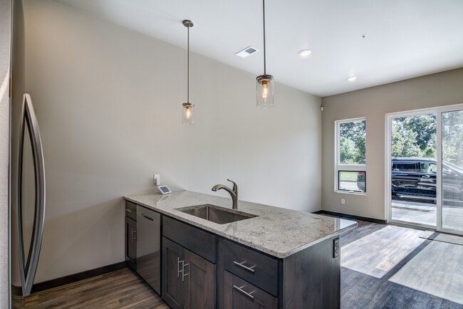 Living Room/Kitchen - River Ridge Luxury Townhomes