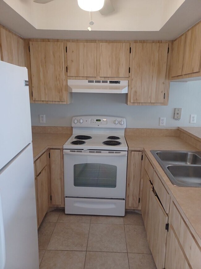 Photo - Community Pool / All Tiled Unit with a screened in lanai / Water Included Unit 913 Gleason Pkwy #2