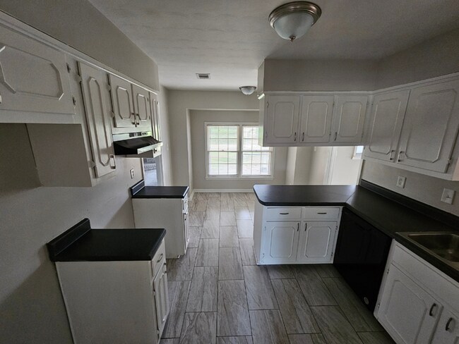 Massive 4BR/3BA Memphis Rental | Brick Fireplace & Built-Ins | Fenced Yard!