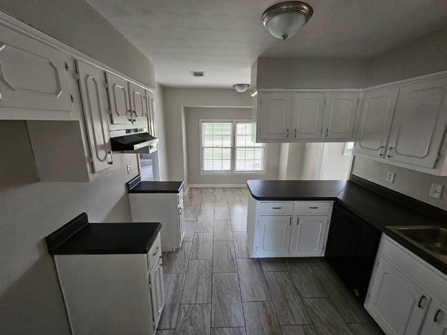 Photo - Massive 4BR/3BA Memphis Rental | Brick Fireplace & Built-Ins | Fenced Yard!