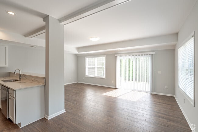 3BR, 2.5BA - 1700SF - Living and Dining Area - Roger Chaffee Apartments